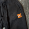 Pantalon Nike Negro Just Do It Etiqueta Naranja
